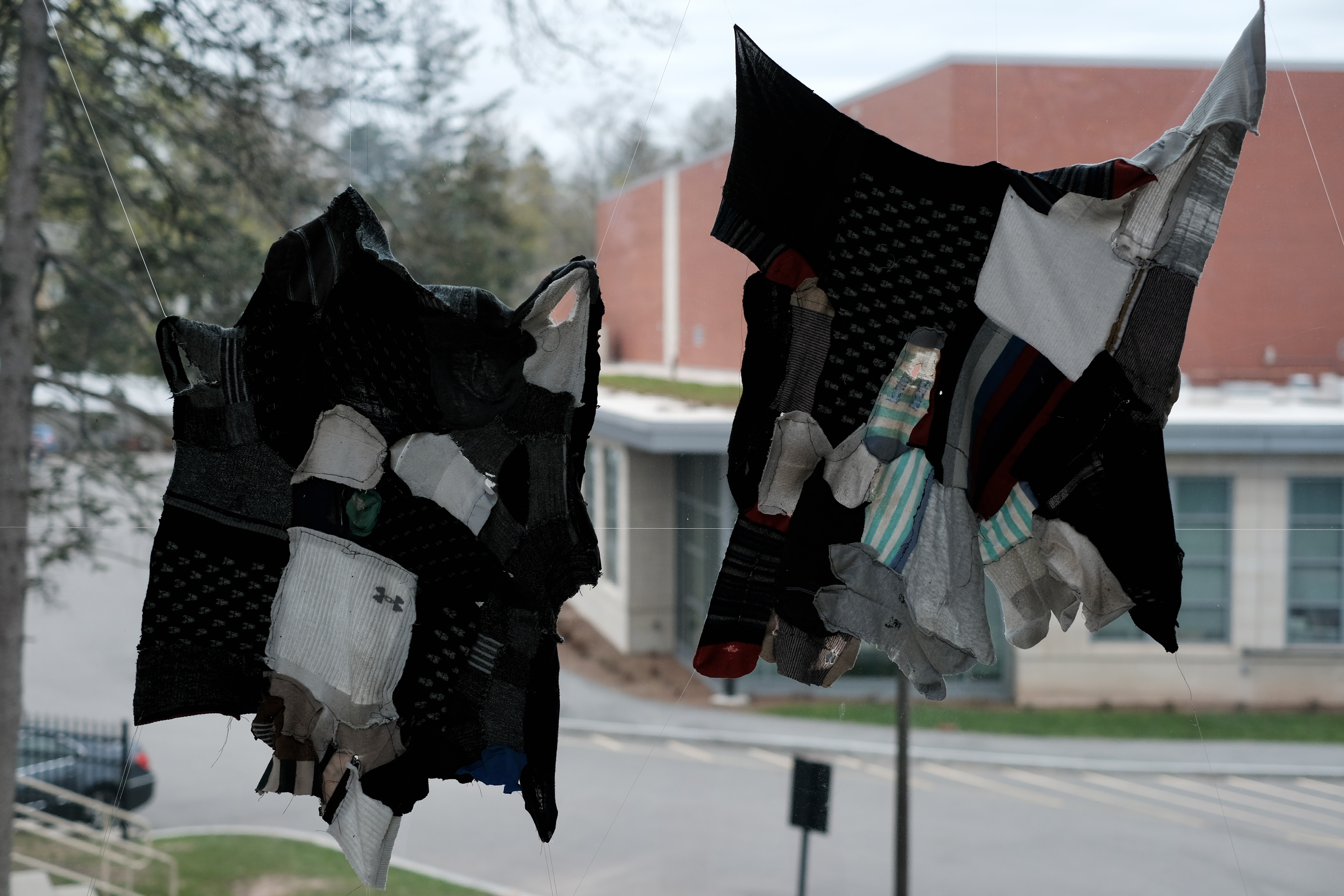 WZÓR installation — fabric in window